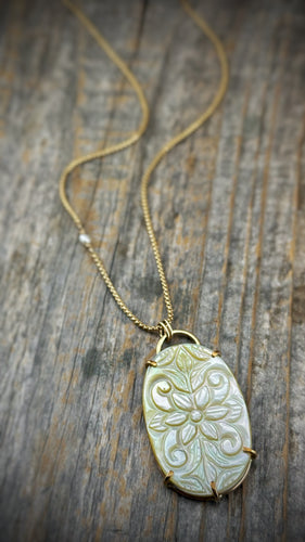 carved mother of pearl pendant