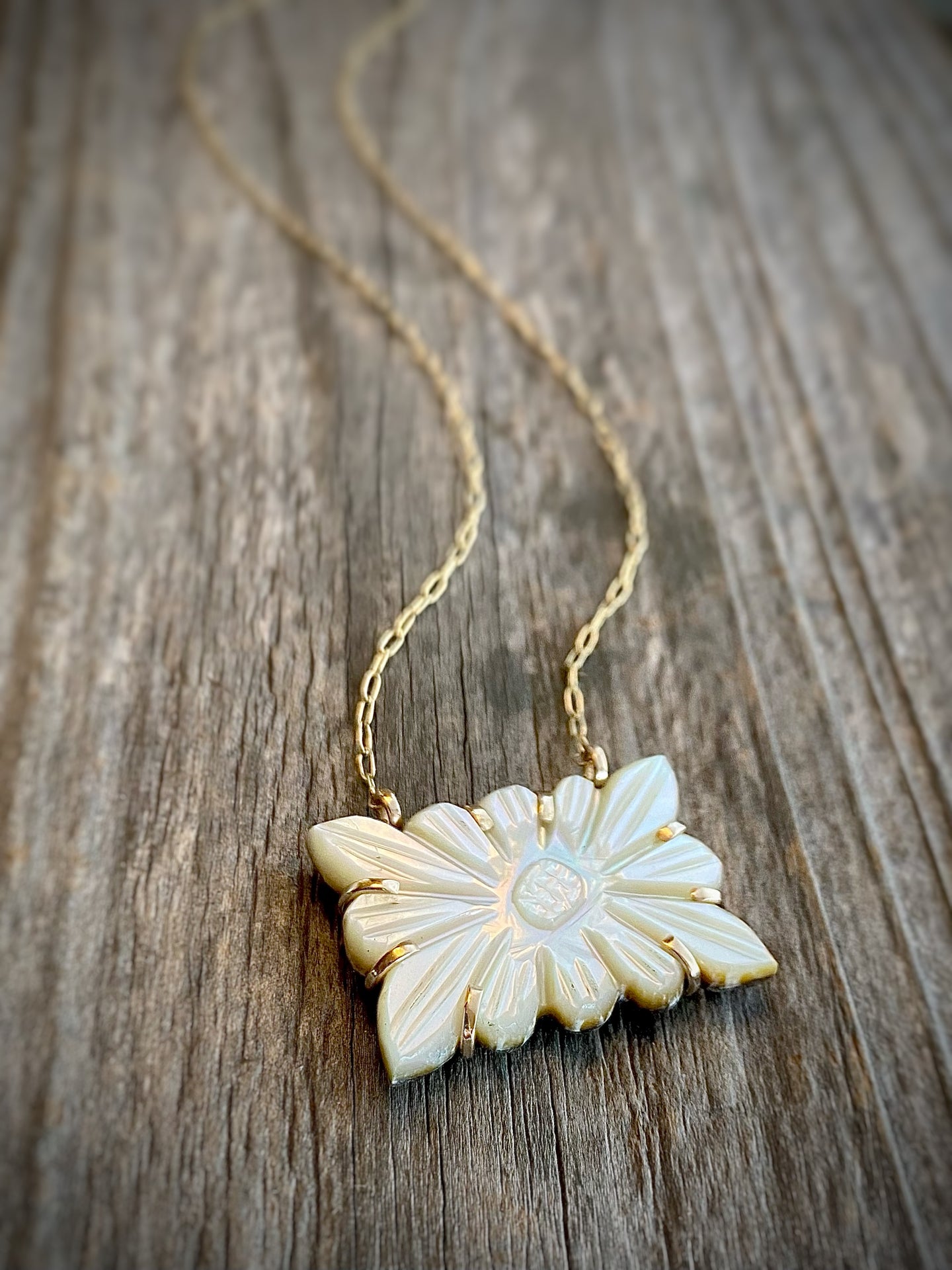 carved mother of pearl pendant